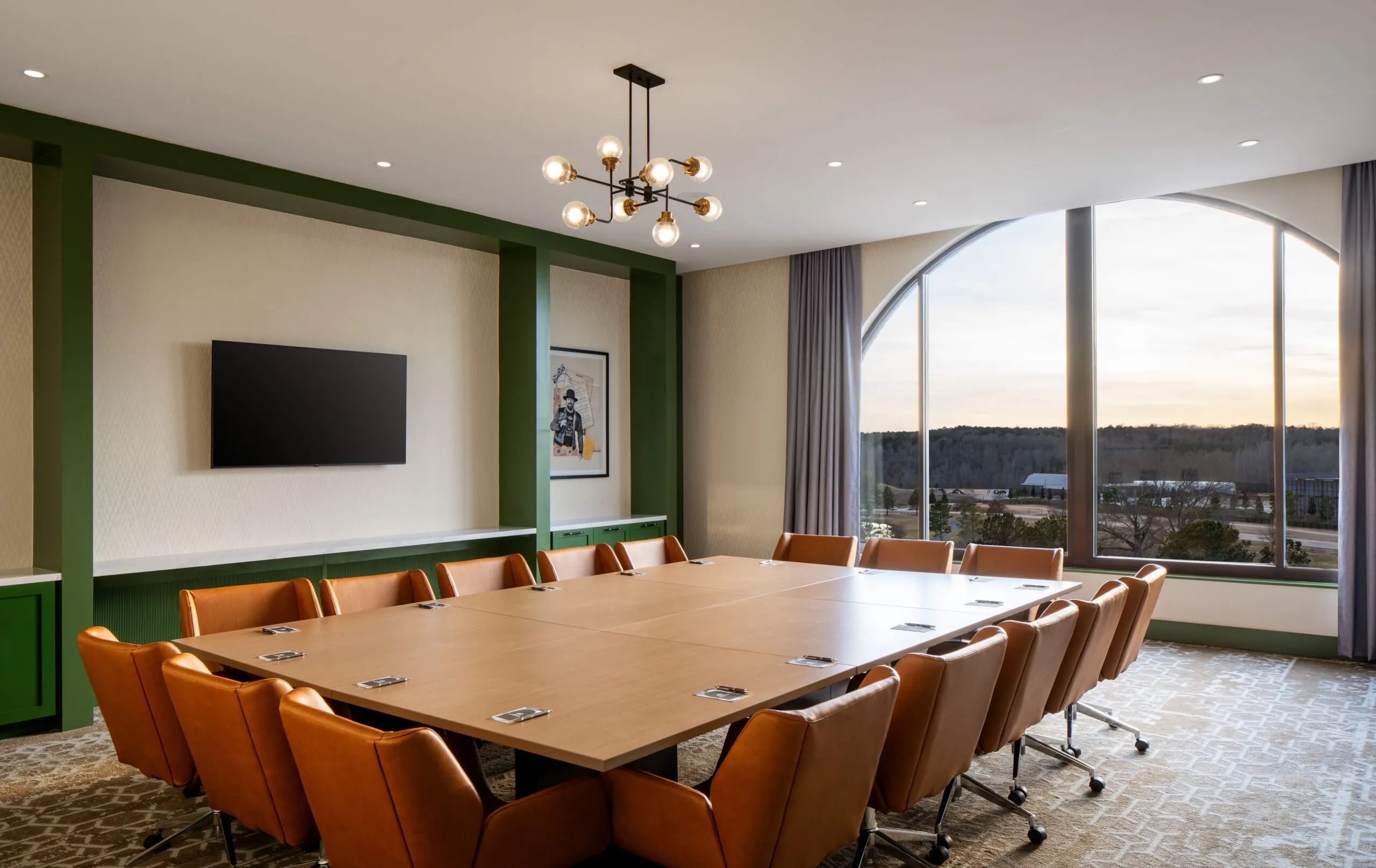 A conference room with a large table and chairs